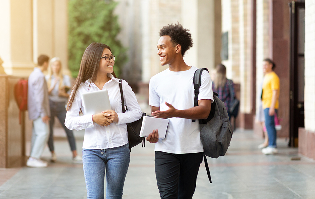 Smart Student Banking. A picture of students walking and discussing