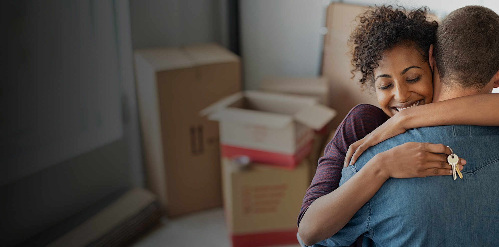 A couple hugging after securing co-op or co-ownership financing